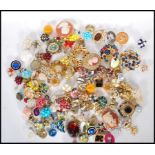 A collection of vintage costume jewellery to include a selection of 60's gold tone brooches,