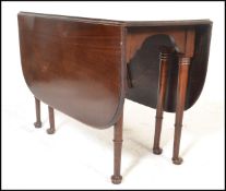 A 19th Century George III mahogany drop leaf dining table, gate leg action supports,raised on shaped