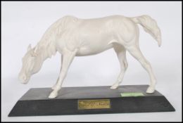 A modern Beswick porcelain figurine entitled ‘ The spirit of Nature ‘ being mounted on plinth and