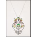A ladies silver Art Nouveau necklace pendant having plique a jour butterflys over flowers.Set to a
