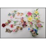 A collection of vintage 20th Century bone china flower jewellery and accessories to include a