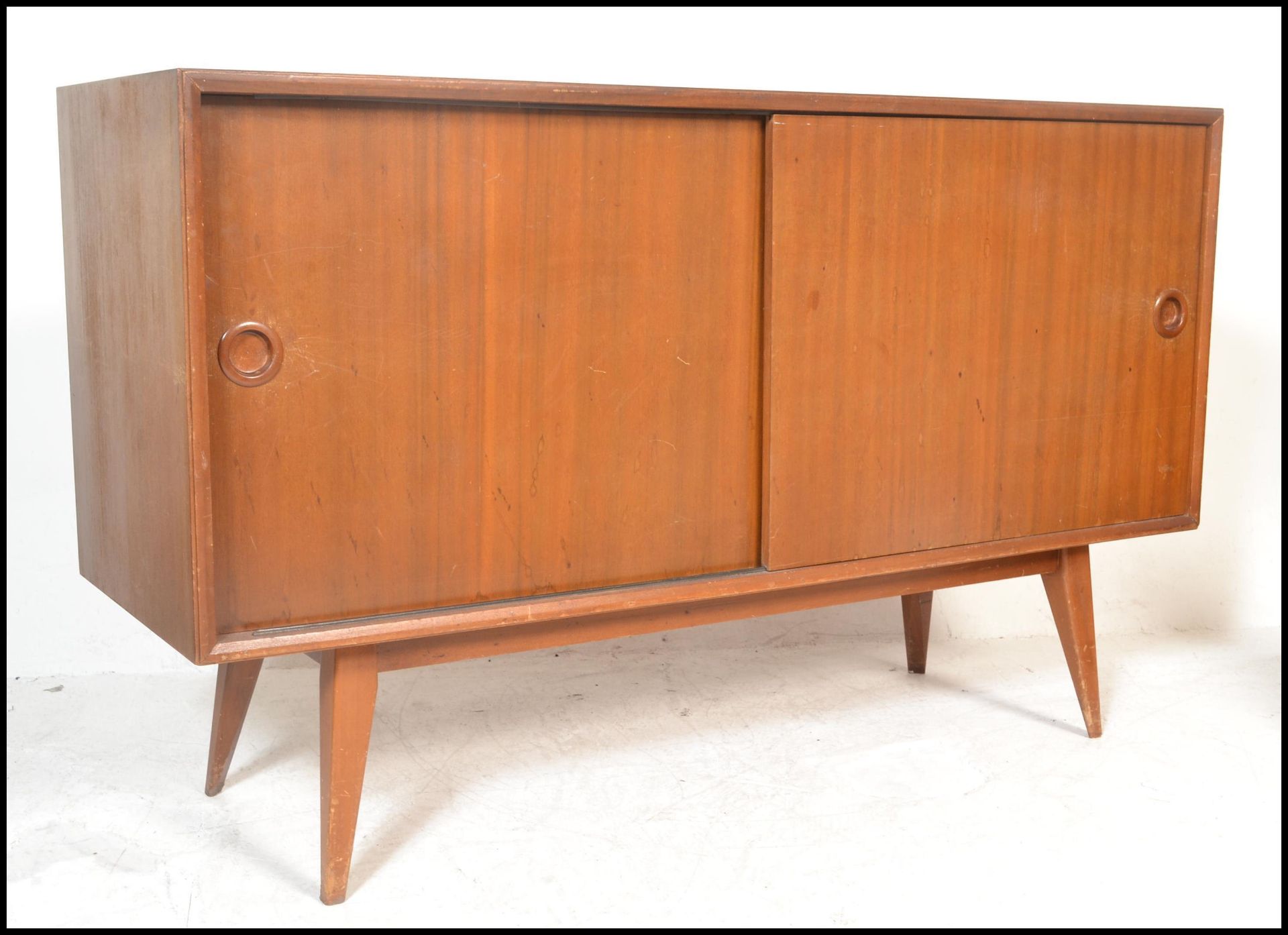A vintage mid 20th Century Vanson walnut sideboard / credenza having twin doors to the front opening