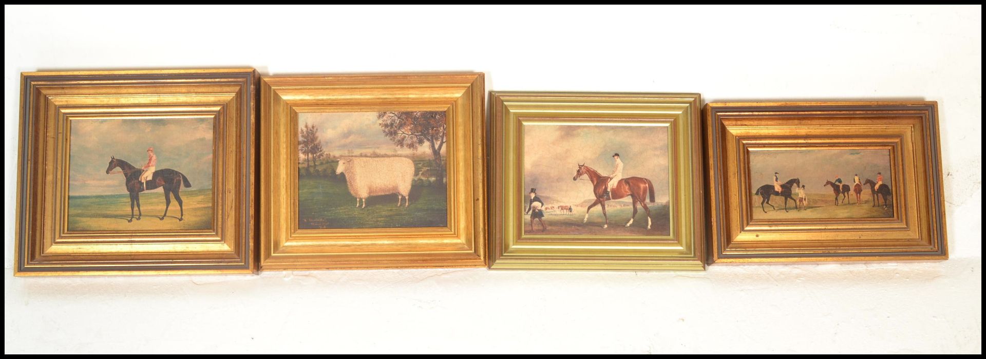 A group of three gilt framed equestrian prints depicting race horses and jockeys. Together with a