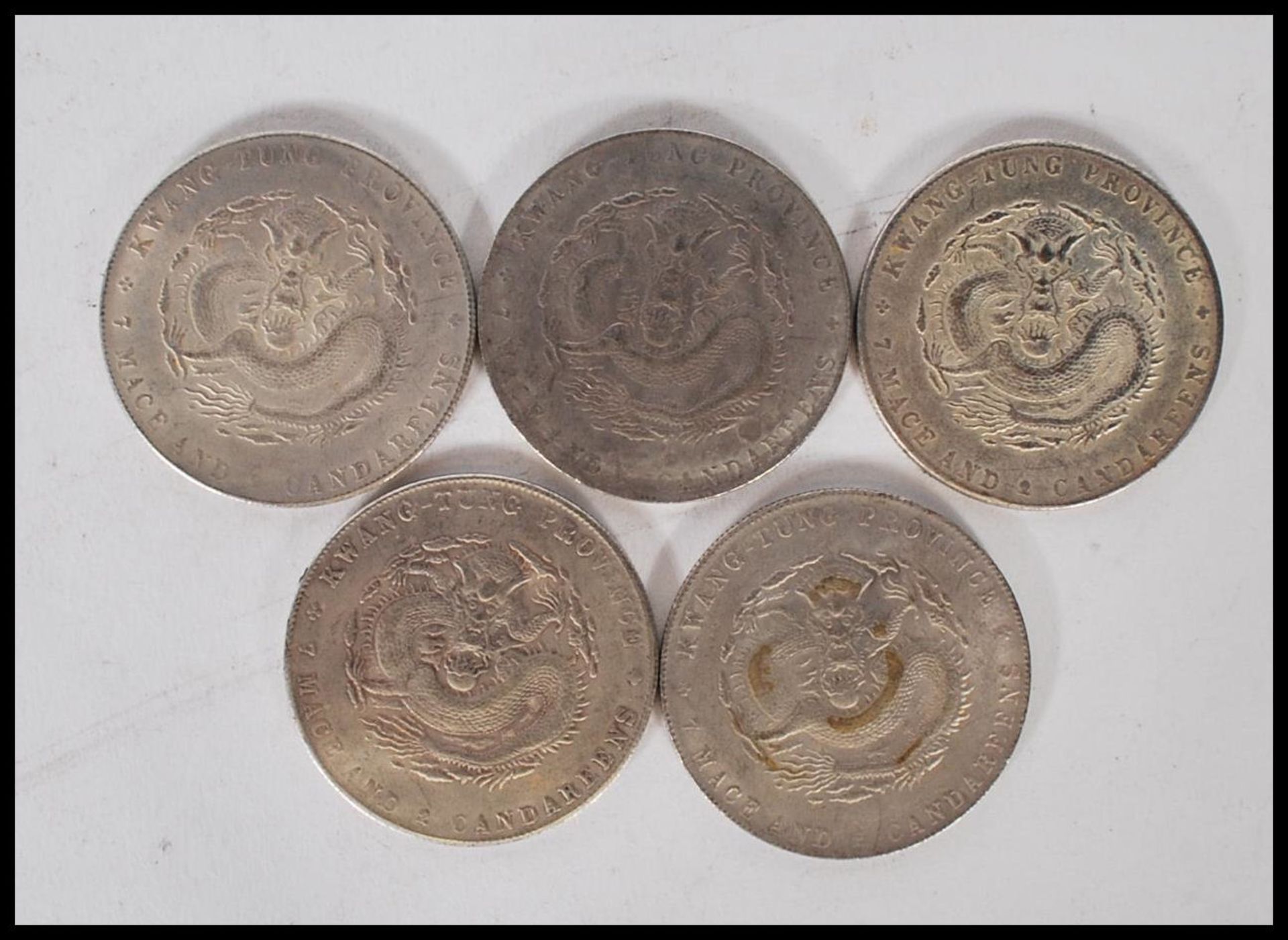 A collection of Chinese coins to include five kwang-tung province coins marked mace and 2