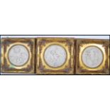 A set of three framed marble composite wall plaque