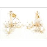 A pair of electric ceiling chandelier lights purchased from Harrods, ..............