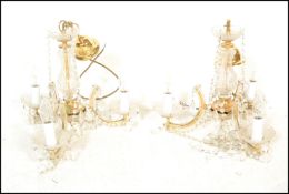 A pair of electric ceiling chandelier lights purchased from Harrods, ..............