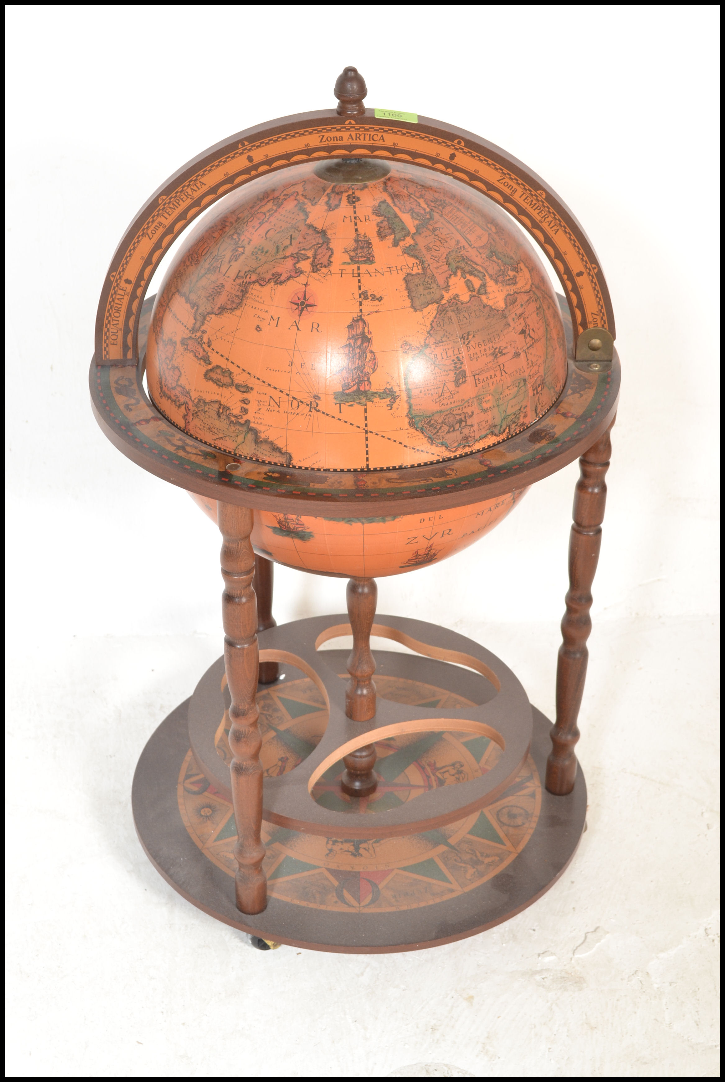 An antique style floor standing cocktail drinks cabinet in the form of a terrestrial globe with - Image 2 of 7