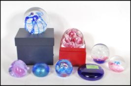 A collection of 20th Century paperweights, mostly
