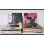 A collection of vinyl LP record albums featuring various artists to include Simon and Garfunkel,
