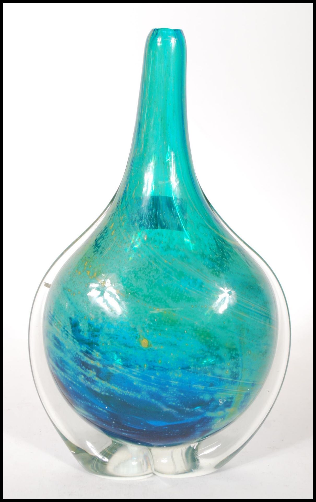 A vintage 20th century Mdina studio art glass stem vase having blue and yellow swirl design.