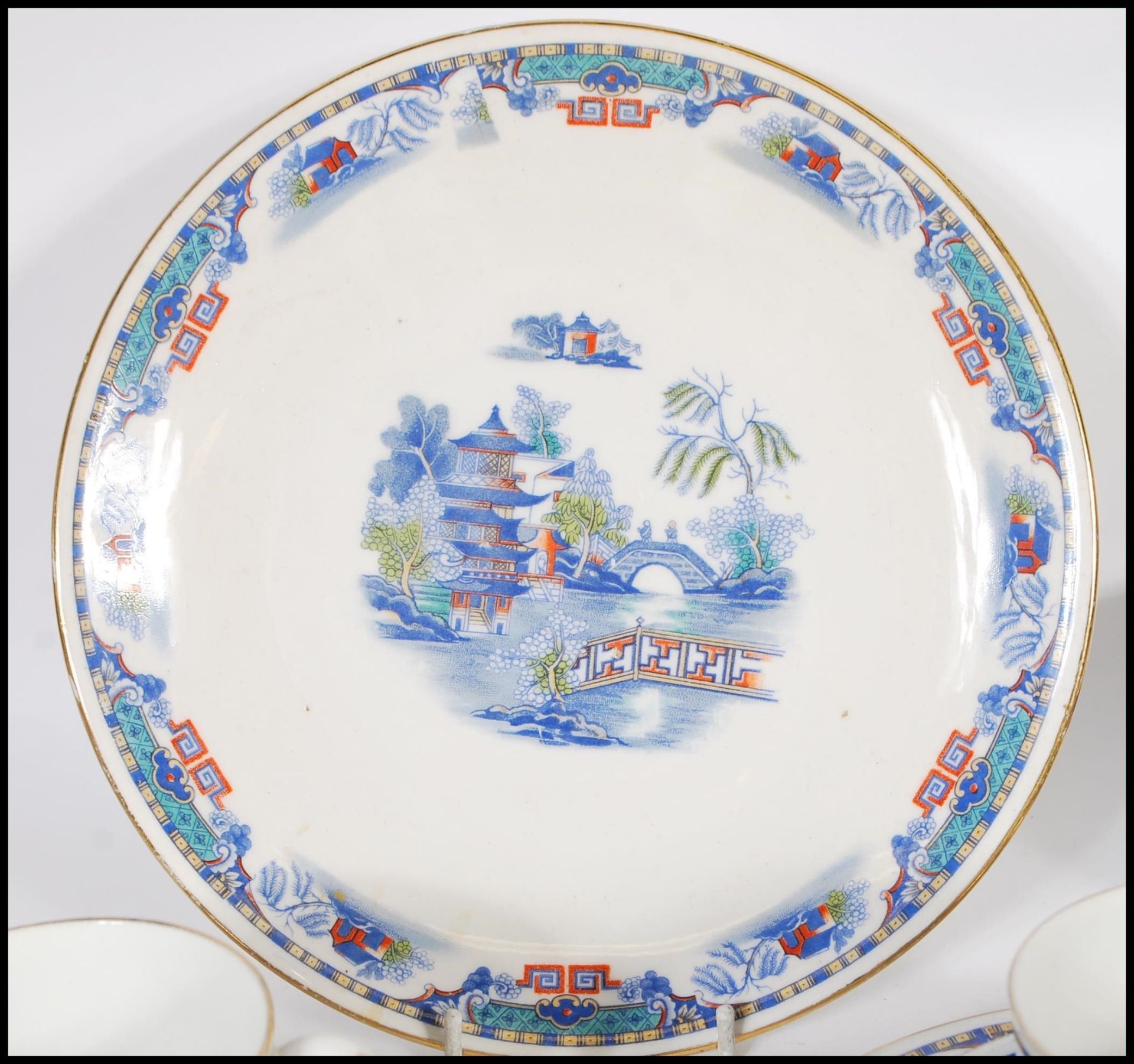 A 20th Century Staffordshire blue and white tea service in the Willow pattern, having red and - Image 3 of 8