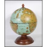 A 20th Century Zoffoli Italian table top drinks cocktail globe set over an oak base hinged top