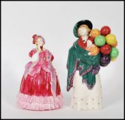 Two Royal Doulton figurines comprising a rare early 20th Century Royal Doulton porcelain figurine