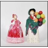 Two Royal Doulton figurines comprising a rare early 20th Century Royal Doulton porcelain figurine