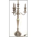 A pair of matching contemporary Georgian revival electric three branch candelabra, each with urn