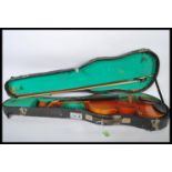 A 20th Century Chinese made student violin musical instrument by Lark contained within fitted case