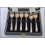A cased set of six Cooper Brothers & Sons silver hallmarked tea spoons having gadrooned finials.
