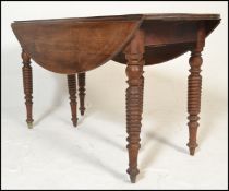 A 19th century French fruit wood drop leaf dining table. Raised on spiral  candy twist turned legs