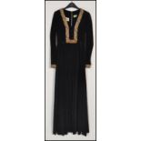 A vintage mid century ladies velvet full length evening gown dress. Velvet with lined interior and