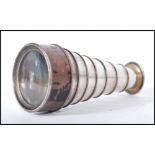 An early 20th / late 19th Century silver plated pocket spyglass monocular telescope, having eight