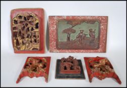 A selection of carved Chinese wooden wall panels / plaques to include a red lacquered panel with