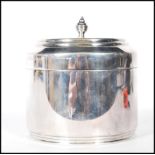 Christopher Dresser for Hukin & Heath silver plated biscuit barrel, hinged lid with finial top.