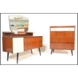 A vintage mid 20th Century teak wood dressing table with a matching chest of drawers, both pieces