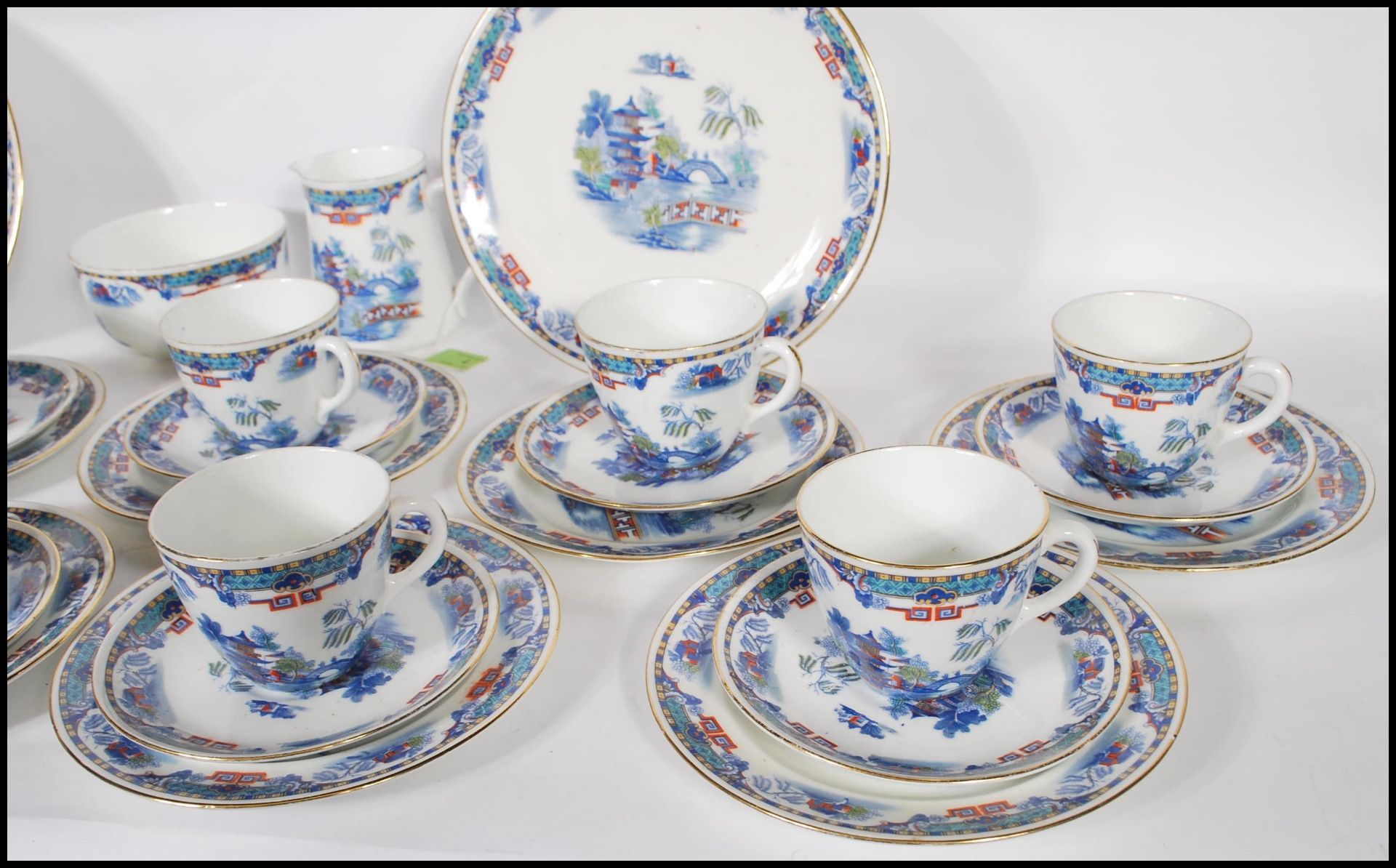 A 20th Century Staffordshire blue and white tea service in the Willow pattern, having red and - Image 7 of 8