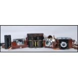 A collection of vintage cameras and binoculars to include 35mm cameras, folding cameras etc.