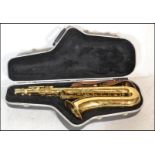 A 20th Century JP 042 gilt bodied saxophone, etched design to body complete in hard case