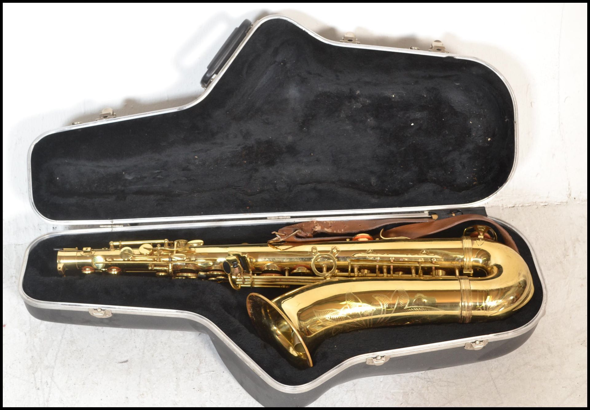 A 20th Century JP 042 gilt bodied saxophone, etched design to body complete in hard case