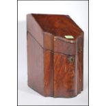 An 18th century George III mahogany inlaid knife box - cutlery box. Of serpentine form with hinged