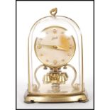 A vintage 1950's German Schatz glass domed anniversary clock having with round faced clock to the