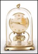 A vintage 1950's German Schatz glass domed anniversary clock having with round faced clock to the