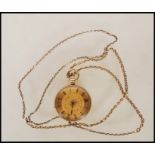 A vintage 18ct gold open faced pocket watch having a gilt face with roman numerals to the chapter