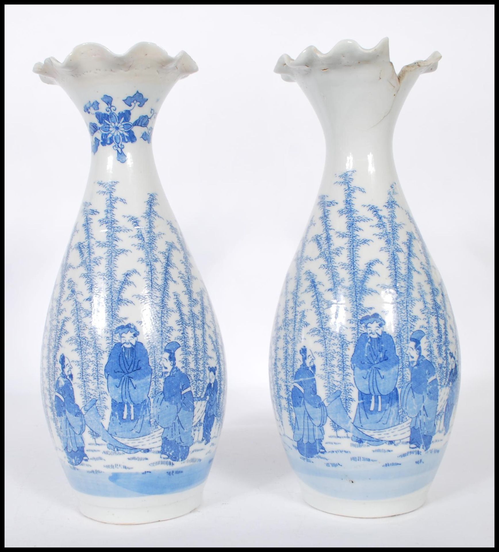 A pair of Japanese porcelain blue and white vases having flared and fanned rims with transfer