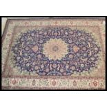 A large Persian floor carpet Keshan rug having a b