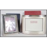 Two contemporary photo frames to include a stamped 925 silver photo frame by Argenti Sovrani
