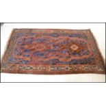 A 19th century Persian / Islamic Tabriz rug with red and blue ground having geometric decorated