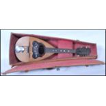 An early 20th Century Gennaro Maglioni mandolin instrument having tortoise shell to the scratch