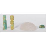 A collection of Egyptian items to include a faience scarab bead, and two faience amulets, and a