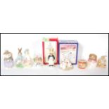 A collection of Beatrix Potter Bunnykins figures to include figures by Beswick, Royal albert etc