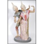 A Lladro very fine tall gres porcelain sculpture depicting Thai dancers, titled 'Thailandia' of