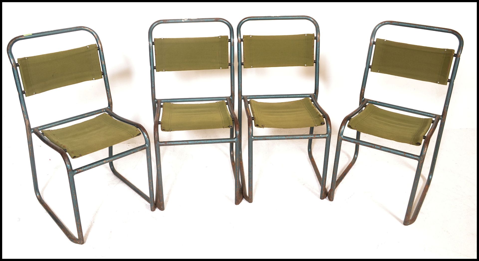 A set of four vintage mid 20th Century metal tubular stacking chairs, original canvas seat pads - Bild 2 aus 7