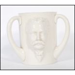 A 19th Century W.H. Goss large triple handled loving cup in relief featuring the bust of W.H.
