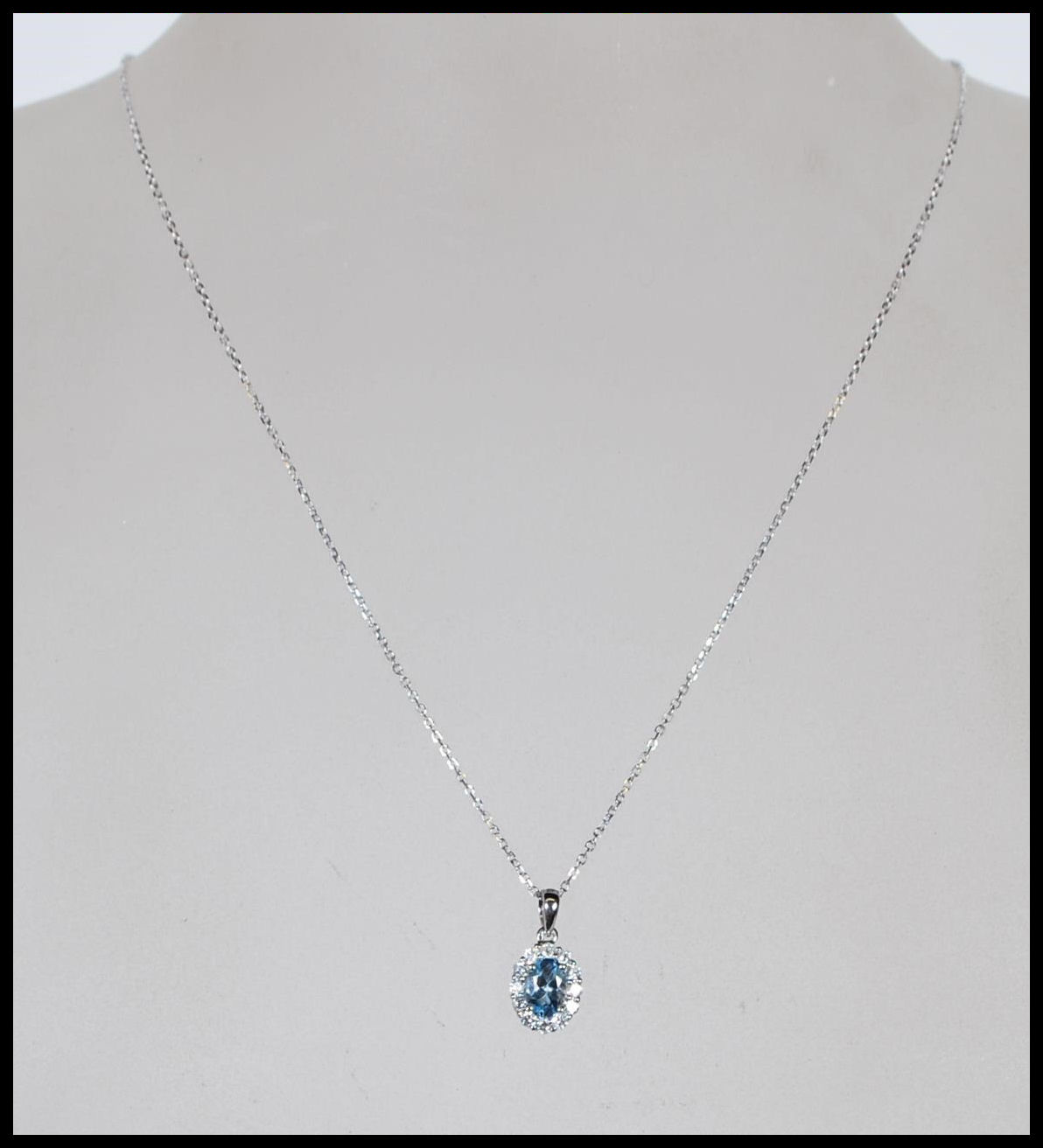 An 18ct white gold, aquamarine and diamond set necklace pendant set to a gold back chai. The central - Image 2 of 5