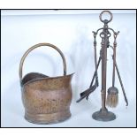 A 19th century Victorian copper coal bucket of cylindrical form having loop handle together with a
