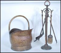 A 19th century Victorian copper coal bucket of cylindrical form having loop handle together with a