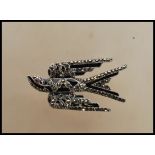 A wonderful silver marcasite and onyx adorned brooch in the form of a swallow bird. Art Deco